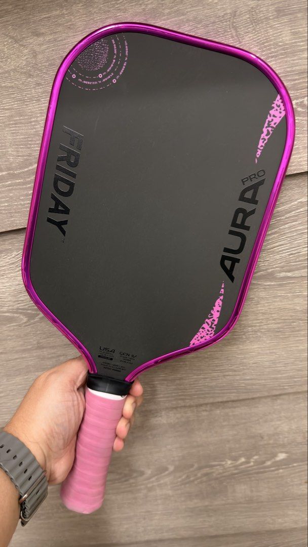 Friday Aura Pro (Category: Racket and Ball Sports) located in Muntinlupa City. Submitted by joboramos (Listing ID 1469576958, Image 2). Description: Friday Aura Pro - Elongated - Metallic Pink - with Cookie Grip and Edge Guard since Day 1 - No dings/scratches - Condition 9.5/10 RFS - extra paddle ni wife For Lalamove or Meetups in Bulacan (Bustos, Baliuag, San Rafael).