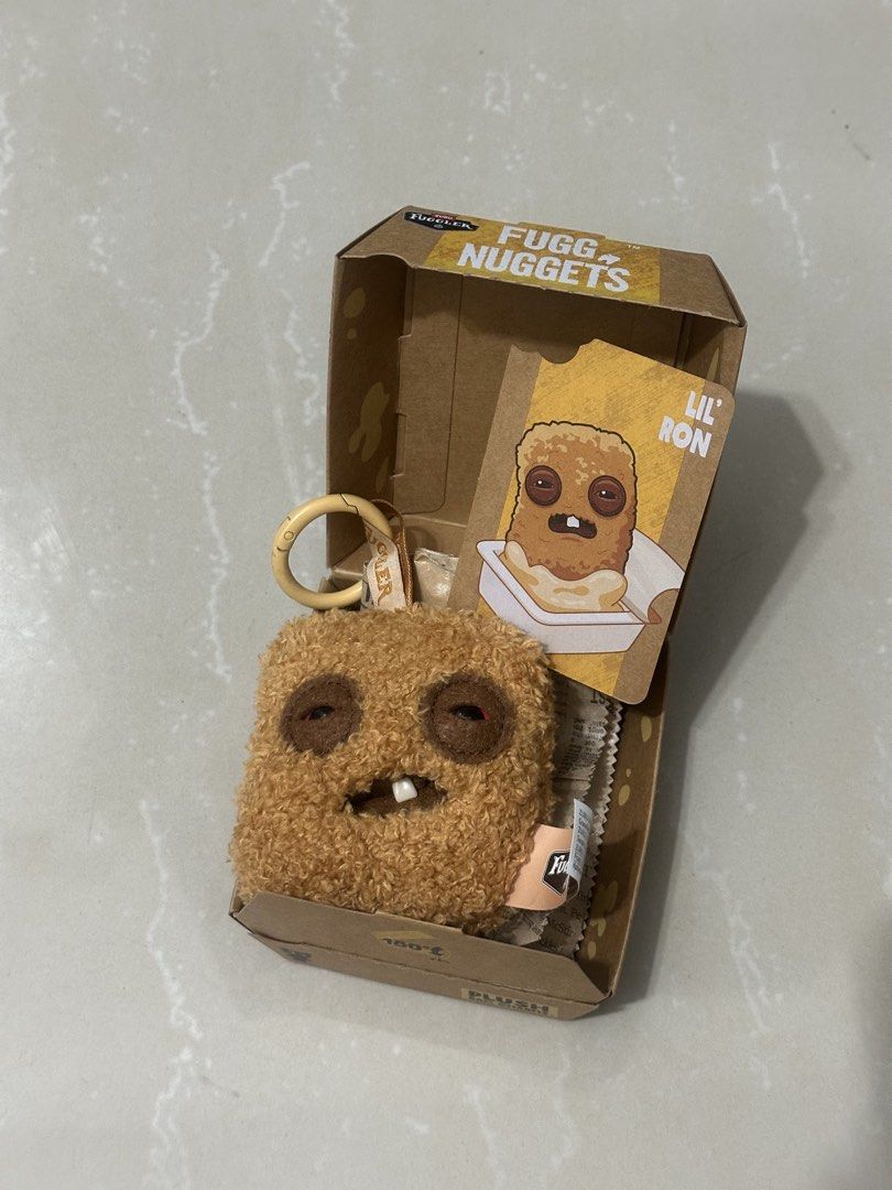Fuggler Nuggets Lil' Ron Plush (Category: Plushies & Soft Toys) located in Manila. Submitted by shoplie (Listing ID 1469586158, Image 1). Description: Freshly pulled Lil’ Ron Fugglet Nugget (unsealed!) Complete set with box & card & foil ₱450 RFS: not my prio Also have blindboxes for sale! SRP only, ₱479. For gifts, can wrap it beautifully for extra fee :) 📍sampaloc, manila.