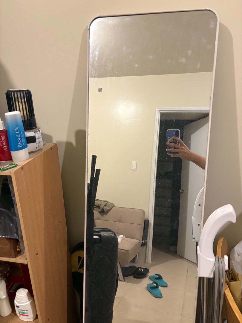 Full Length Standing Mirror with Metal Stand (Category: Mirrors) located in Manila. Submitted by loislane112233 (Listing ID 1469679078, Image 2). Description: - Elegant tall standing mirror with a minimalist thin white frame - Chic rounded top corners for a modern aesthetic - Built-in metal stand at the back for secure and stable upright placement - Works great on both tile and wooden floors - Provides a clean, distortion-free reflection ideal fo