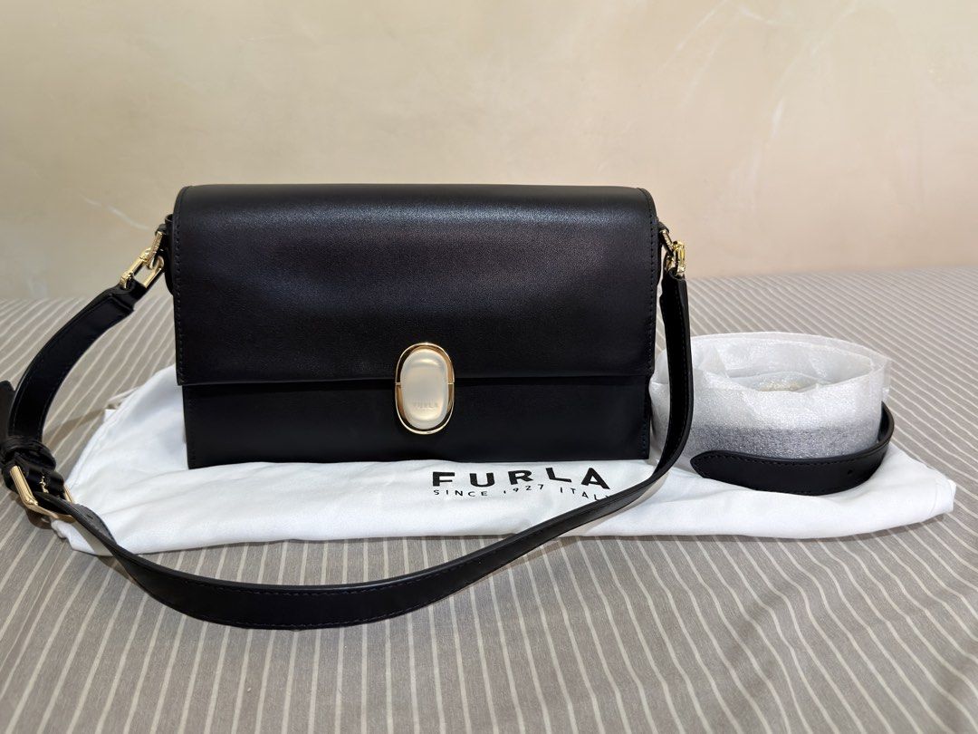 Furla Eclisse Crossbody (Category: Cross-body Bags) located in San Mateo. Submitted by ktrnugh (Listing ID 1469614748, Image 1). Description: Furla Eclisse Crossbody (Regular size) Color: Nero / Black Condition: Excellent — used once only! Store-bought (June 2026) / authentic Comes with original dust bag , crossbody strap RFS: Decluttering 📍Batasan Hills, QC Delivery: Same-day delivery via Grab or Lalamove (shipping fee to be shouldered by the b