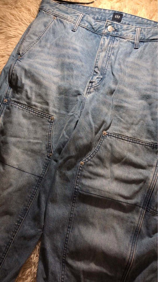 Gap Double Knee Carpenter Pants (Category: Jeans) located in Maria Aurora. Submitted by kylerikathriftshop101010 (Listing ID 1469721577, Image 2). Description: 36 waist 37.5 length (altered ) 11 hem - Brand: Gap - Style: Denim carpenter jeans with relaxed fit - Wash: Light wash with natural fading - Details: Front double knee panels, side tool pockets, left leg hammer loop, and branded button closure - Material: Sturdy, durable cotton denim - Con