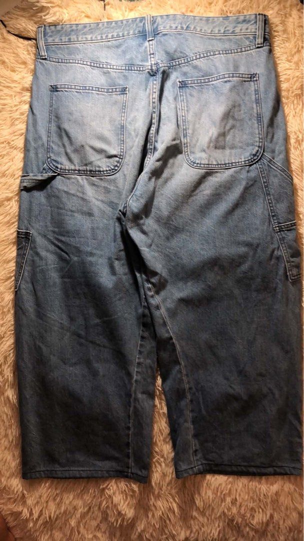 Gap Double Knee Carpenter Pants (Category: Jeans) located in Maria Aurora. Submitted by kylerikathriftshop101010 (Listing ID 1469721577, Image 3). Description: 36 waist 37.5 length (altered ) 11 hem - Brand: Gap - Style: Denim carpenter jeans with relaxed fit - Wash: Light wash with natural fading - Details: Front double knee panels, side tool pockets, left leg hammer loop, and branded button closure - Material: Sturdy, durable cotton denim - Con