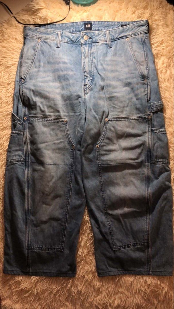 Gap Double Knee Carpenter Pants (Category: Jeans) located in Maria Aurora. Submitted by kylerikathriftshop101010 (Listing ID 1469721577, Image 1). Description: 36 waist 37.5 length (altered ) 11 hem - Brand: Gap - Style: Denim carpenter jeans with relaxed fit - Wash: Light wash with natural fading - Details: Front double knee panels, side tool pockets, left leg hammer loop, and branded button closure - Material: Sturdy, durable cotton denim - Con