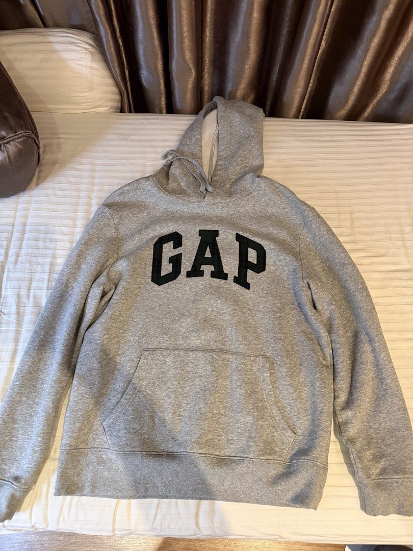 GAP Grey Hoodie Size M (Category: Hoodies) located in Muntinlupa City. Submitted by golf823 (Listing ID 1469681443, Image 1). Description: - Size: Medium - Color: Classic Grey - Design: Embroidered GAP logo on chest - Features: Drawstring hood & front kangaroo pocket - Interior: Soft fleece lining - Condition: Clean and ready to wear.