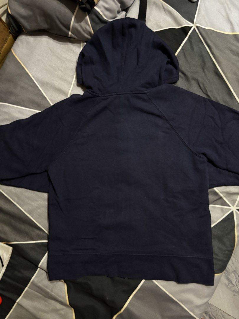GAP Navy Blue Zip-Up Hoodie (Category: Coats, Jackets and Outerwear) located in Manila. Submitted by bizcuits (Listing ID 1469738597, Image 2). Description: - Brand: GAP - Color: Navy Blue - Size: (S) 20 width by 23 length - Material: 77% Cotton, 23% Polyester blend - Design: Big embroidered logo across the chest - Features: Full zipper closure, adjustable drawstring hood, and front pockets - Condition: Excellent.