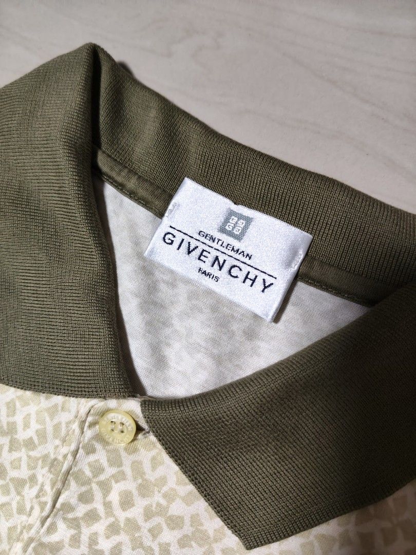 Gentleman Givenchy Vintage Pattern Polo Shirt (Category: Tshirts & Polo Shirts ) located in Manila. Submitted by si_yannnn (Listing ID 1469721428, Image 3). Description: Gentleman Givenchy polo shirt from Paris. Cream and beige geometric pattern all over with olive green collar. Single chest pocket featuring the Givenchy 4G logo embroidery. Made in Italy, 100% cotton fabric. Button placket at the front..