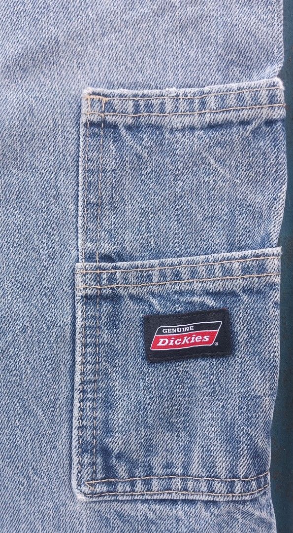 Genuine Dickies Denim Cargo Shorts (Category: Shorts) located in Muntinlupa City. Submitted by thriftben (Listing ID 1469618593, Image 3). Description: - Brand: Genuine Dickies - Style: Denim cargo shorts / Carpenter style - Color: Light wash blue - Features: Side utility pocket, back pockets, and branded metal button closure - Material: Sturdy cotton denim with contrast stitching - Aesthetic: Rugged workwear, perfect for casual streetwear.