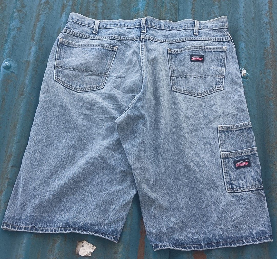 Genuine Dickies Denim Cargo Shorts (Category: Shorts) located in Muntinlupa City. Submitted by thriftben (Listing ID 1469618593, Image 1). Description: - Brand: Genuine Dickies - Style: Denim cargo shorts / Carpenter style - Color: Light wash blue - Features: Side utility pocket, back pockets, and branded metal button closure - Material: Sturdy cotton denim with contrast stitching - Aesthetic: Rugged workwear, perfect for casual streetwear.