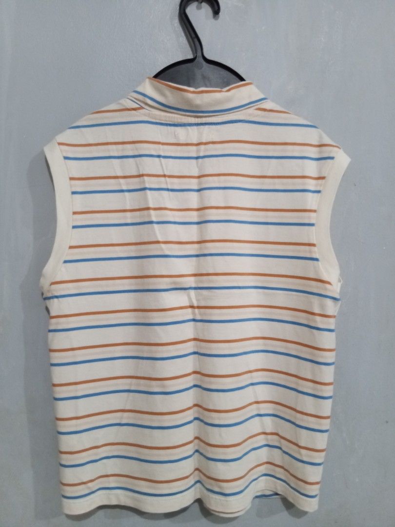 Gingersnaps Sleeveless Striped Sailor Collar Top (Category: Babies & Kids Fashion) located in Bacoor. Submitted by thriftworksph (Listing ID 1469611440, Image 2). Description: - Brand: Gingersnaps - Size: 12Y - Design: Cream with brown and blue horizontal stripes - Details: Sailor style collar with front tie, anchor embroidered chest pocket - Material: Lightweight cotton, ideal for warm weather - Condition: Clean and well-maintained.