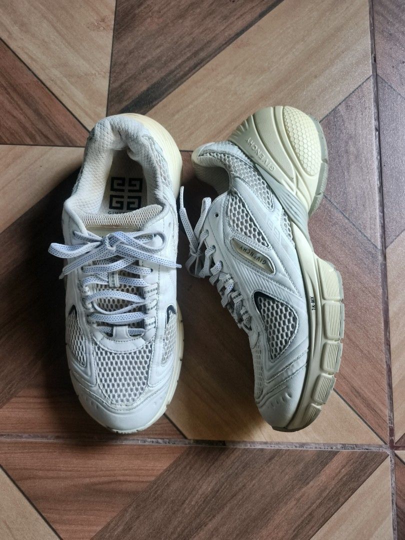 Givenchy TK-MX Sneakers White (Category: Sneakers) located in Zamboanga. Submitted by d2977250664046 (Listing ID 1469674942, Image 1). Description: - Brand: Givenchy - Size 40 - Model: TK-MX Sneakers - Color: White - Material: Chunky mesh and leather upper - Details: Debossed branding on side and heel, unique textured sole with Givenchy lettering and 'Made in Italy' stamp - Closure: Regular lace-up - Condition: Pre-owned with normal wear on soles