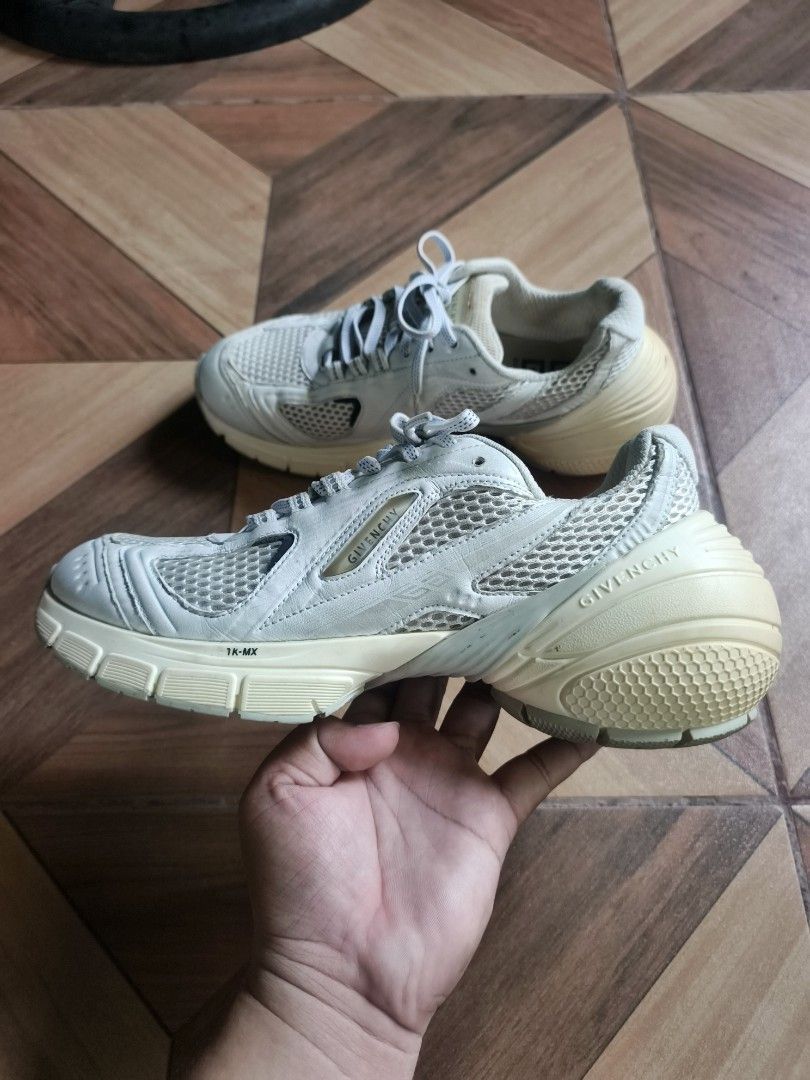 Givenchy TK-MX Sneakers White (Category: Sneakers) located in Zamboanga. Submitted by d2977250664046 (Listing ID 1469674942, Image 3). Description: - Brand: Givenchy - Size 40 - Model: TK-MX Sneakers - Color: White - Material: Chunky mesh and leather upper - Details: Debossed branding on side and heel, unique textured sole with Givenchy lettering and 'Made in Italy' stamp - Closure: Regular lace-up - Condition: Pre-owned with normal wear on soles