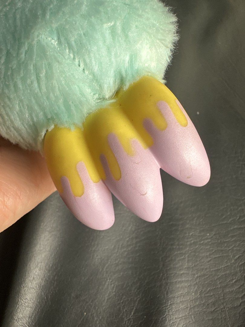 Gloomy Arm keychain (Category: Plushies & Soft Toys) located in Cainta. Submitted by shopbyyna (Listing ID 1469637444, Image 3). Description: - Authentic Taito prize item (Tagged CGP-307) - Super soft mint green fuzzy plush body - Cute dangling feet in pinkish-purple and yellow details - Equipped with a stylish metallic pink carabiner clip - Brand new with original red paper tag attached.