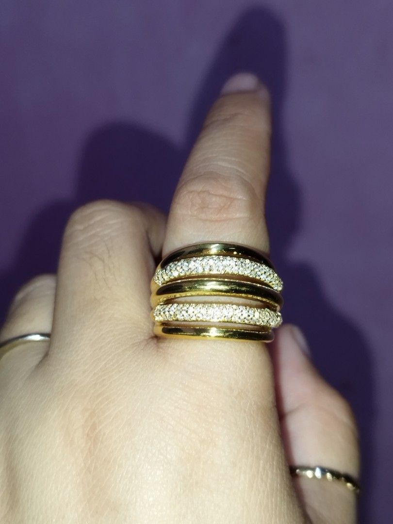 Gold Plated 925 Silver Multi Band Pave Ring (Category: Rings) located in Manila. Submitted by Cie28 (Listing ID 1469717229, Image 2). Description: - Material: Gold-plated 925 sterling silver (hallmark stamp inside) - Design: Bold statement multi-band with alternating polished and pave-set crystal bands - Feel: Solid weight and comfortable fit - Condition: Brand new and ready to wear - size 8.