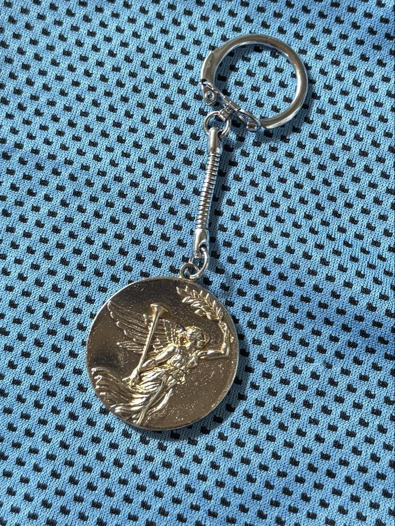 Gold-Tone Winged Victory Keychain | Engravable Success & Milestone Gift (Category: Charms) located in Bacarra. Submitted by retrovival (Listing ID 1469578367, Image 3). Description: 🏆 Carry a reminder of your victory. Featuring a figure of Nike, the Greek goddess of victory, known as Victoria in Roman mythology, this keychain is a meaningful keepsake for achievements worth remembering. Its gold tone symbolizes success, excellence, and triumph, r