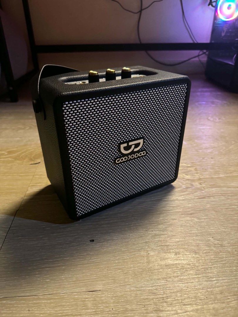 GOOJODOQ AB4098 Bluetooth Speaker with Two Microphones (Category: Soundbars, Speakers & Amplifiers) located in Cavite. Submitted by jwai27 (Listing ID 1469687534, Image 2). Description: - Model: GOOJODOQ AB4098 Bluetooth Speaker - Color: Sleek black with premium physical gold dials - Audio Control: Independent dials for volume, bass, and treble adjustments - Inclusion: 2 wireless microphones for ultimate karaoke sessions - Accessories: Charging c