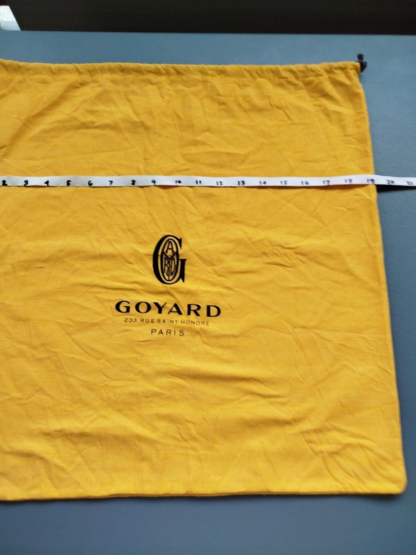 Goyard Yellow Cotton Drawstring Dust Bag (Category: Luxury Bags & Wallets) located in Calamba. Submitted by merrymerida (Listing ID 1469629462, Image 3). Description: - Authentic bright yellow Goyard dust bag - Features the classic black Goyard Paris logo on the front - Measures approximately 20 x 20 inches - Double black drawstring closure with stylish knotted ends - Clean fabric overall, shows only minor flat storage wrinkles.