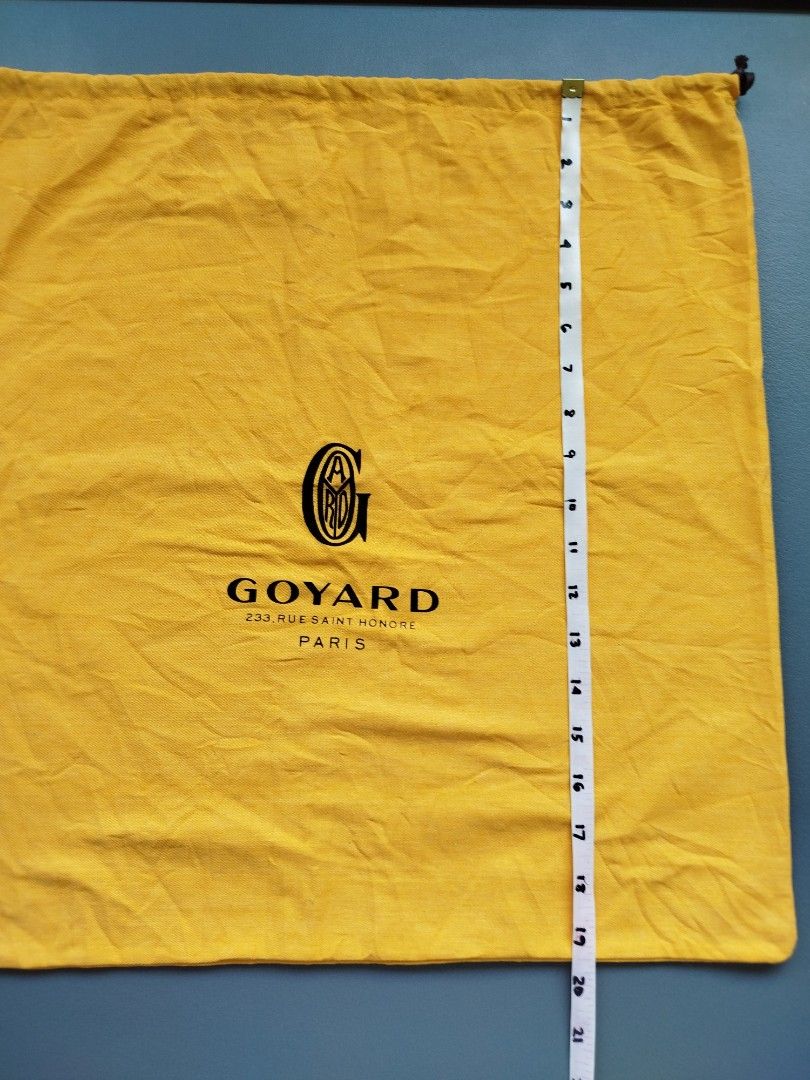 Goyard Yellow Cotton Drawstring Dust Bag (Category: Luxury Bags & Wallets) located in Calamba. Submitted by merrymerida (Listing ID 1469629462, Image 2). Description: - Authentic bright yellow Goyard dust bag - Features the classic black Goyard Paris logo on the front - Measures approximately 20 x 20 inches - Double black drawstring closure with stylish knotted ends - Clean fabric overall, shows only minor flat storage wrinkles.