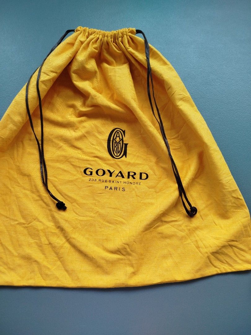 Goyard Yellow Cotton Drawstring Dust Bag (Category: Luxury Bags & Wallets) located in Calamba. Submitted by merrymerida (Listing ID 1469629462, Image 1). Description: - Authentic bright yellow Goyard dust bag - Features the classic black Goyard Paris logo on the front - Measures approximately 20 x 20 inches - Double black drawstring closure with stylish knotted ends - Clean fabric overall, shows only minor flat storage wrinkles.