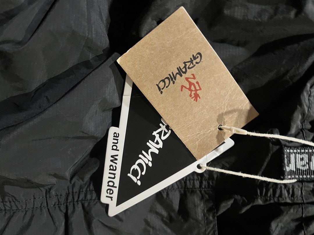 Gramicci and Wander Cargo Pants Black (Category: Trousers) located in Bacoor. Submitted by 4103archivalgarmentph (Listing ID 1469652544, Image 3). Description: - Brand new with original tags attached - Collaboration between Gramicci and and wander in classic black - Size: USA L / Asia XL - Durable ripstop fabric construction - Reflective taped zippers and branding details - Integrated webbed belt at the waist for an adjustable fit - Multiple util