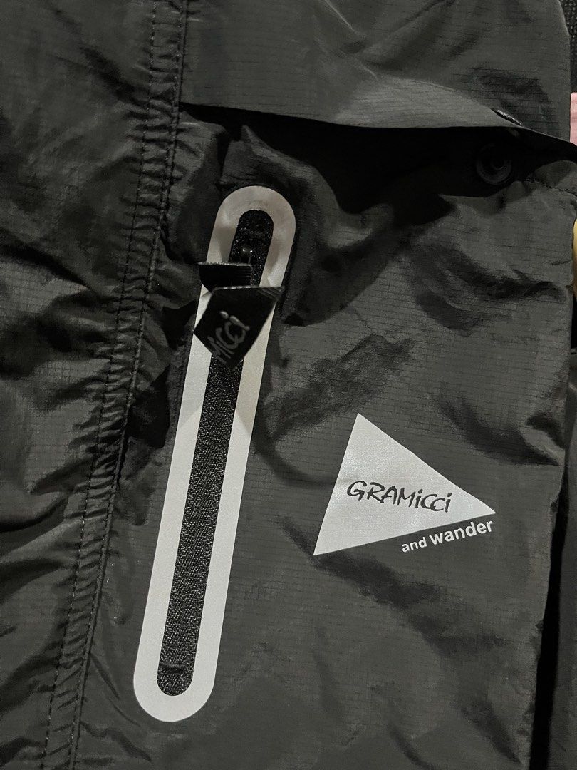 Gramicci and Wander Cargo Pants Black (Category: Trousers) located in Bacoor. Submitted by 4103archivalgarmentph (Listing ID 1469652544, Image 2). Description: - Brand new with original tags attached - Collaboration between Gramicci and and wander in classic black - Size: USA L / Asia XL - Durable ripstop fabric construction - Reflective taped zippers and branding details - Integrated webbed belt at the waist for an adjustable fit - Multiple util