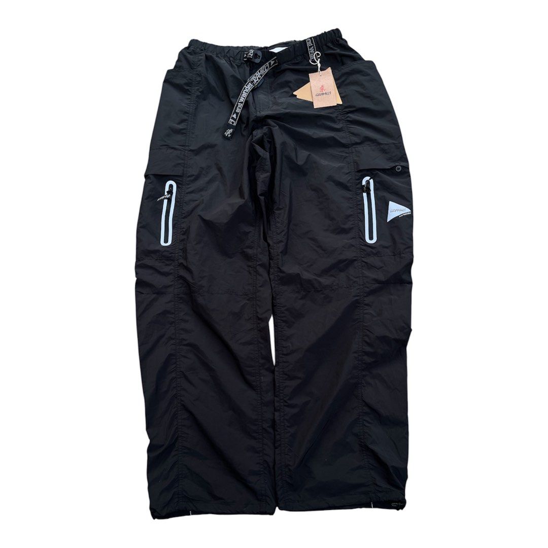 Gramicci and Wander Cargo Pants Black (Category: Trousers) located in Bacoor. Submitted by 4103archivalgarmentph (Listing ID 1469652544, Image 1). Description: - Brand new with original tags attached - Collaboration between Gramicci and and wander in classic black - Size: USA L / Asia XL - Durable ripstop fabric construction - Reflective taped zippers and branding details - Integrated webbed belt at the waist for an adjustable fit - Multiple util