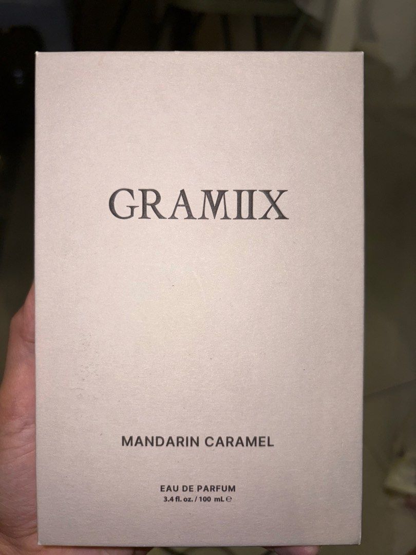 Gramiix Mandarin Caramel Eau De Parfum 100ml (Category: Fragrance & Deodorants) located in Antipolo. Submitted by laikaandrea_ (Listing ID 1469713164, Image 2). Description: - Brand: Gramiix - Fragrance Name: Mandarin Caramel - Size: 3.4 fl oz / 100 mL (Eau de Parfum) - Fragrance Family: Amber, Gourmand, Citrus - Top Notes: Heliotrope, Coconut Powder - Mid Notes: Vanilla, Sandalwood - Base Notes: Palo Santo, Musk - Condition: Used once - Packagin