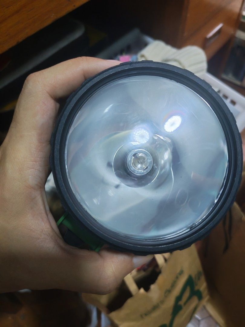 Green Heavy Duty Lantern Flashlight D Size (Category: Lighting) located in Manila. Submitted by GentleGiant (Listing ID 1469758604, Image 2). Description: Green plastic body with a black top bezel. Runs on four D size 1.5V batteries. Metal contact springs inside the battery compartment. Clear lens with a central bulb socket. Patent numbers molded onto the base. Handy side handle design. Good camping or emergency gear..