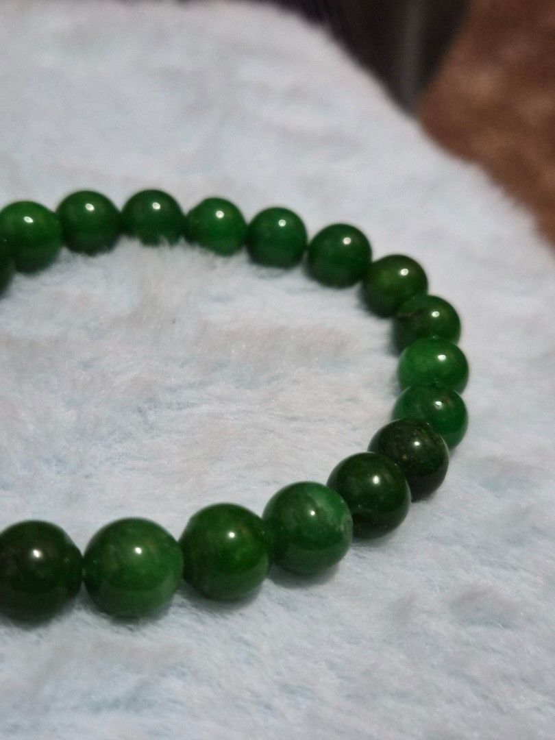 Green Jade Bead Bracelet (Category: Bracelets) located in Mandaue City. Submitted by chuchi152615 (Listing ID 1469685989, Image 3). Description: - Material: Genuine green jade natural stones - Design: Polished round beads in mixed light and dark green tones - Fit: Standard wrist size with a convenient stretch cord for easy wear - Unique: Each bead features one-of-a-kind natural stone variations - Condition: Brand new and ready to wear.