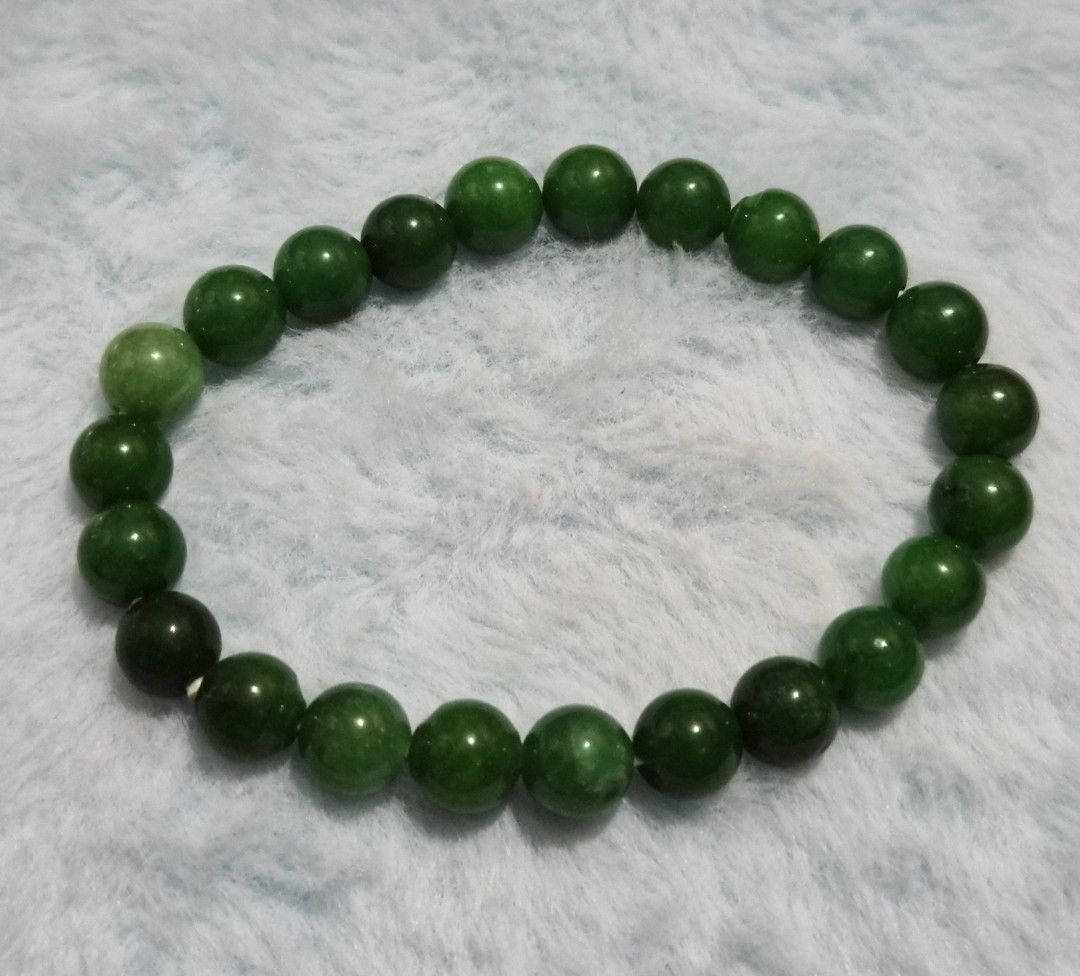Green Jade Bead Bracelet (Category: Bracelets) located in Mandaue City. Submitted by chuchi152615 (Listing ID 1469685989, Image 1). Description: - Material: Genuine green jade natural stones - Design: Polished round beads in mixed light and dark green tones - Fit: Standard wrist size with a convenient stretch cord for easy wear - Unique: Each bead features one-of-a-kind natural stone variations - Condition: Brand new and ready to wear.