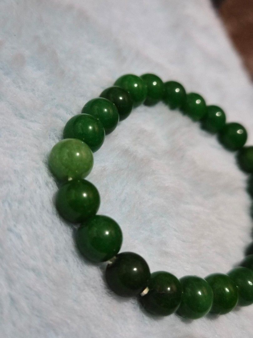 Green Jade Bead Bracelet (Category: Bracelets) located in Mandaue City. Submitted by chuchi152615 (Listing ID 1469685989, Image 2). Description: - Material: Genuine green jade natural stones - Design: Polished round beads in mixed light and dark green tones - Fit: Standard wrist size with a convenient stretch cord for easy wear - Unique: Each bead features one-of-a-kind natural stone variations - Condition: Brand new and ready to wear.