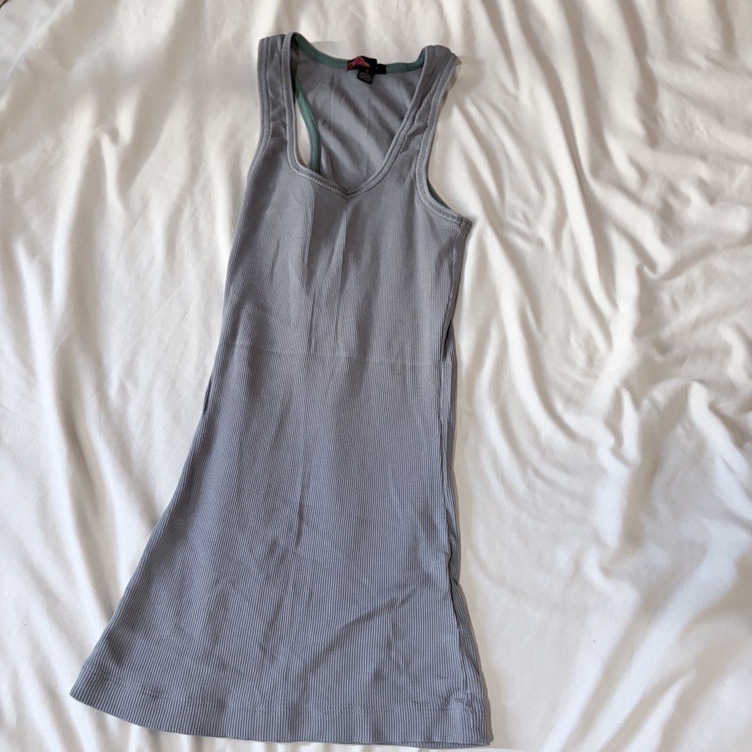 Grey ribbed tank top racerback sleeveless (Category: Sleeveless) located in Quezon City. Submitted by angelajuliet__ (Listing ID 1469625004, Image 1). Description: - FREE TO ANY OF MY BUYERS HEHE - Color: Grey - Style: Ribbed racerback tank top with longline fit - Details: Contrasting trim on neckline and straps - Material: Soft, stretchy fabric for all-day comfort - Versatility: Great basic for daily wear or layering.