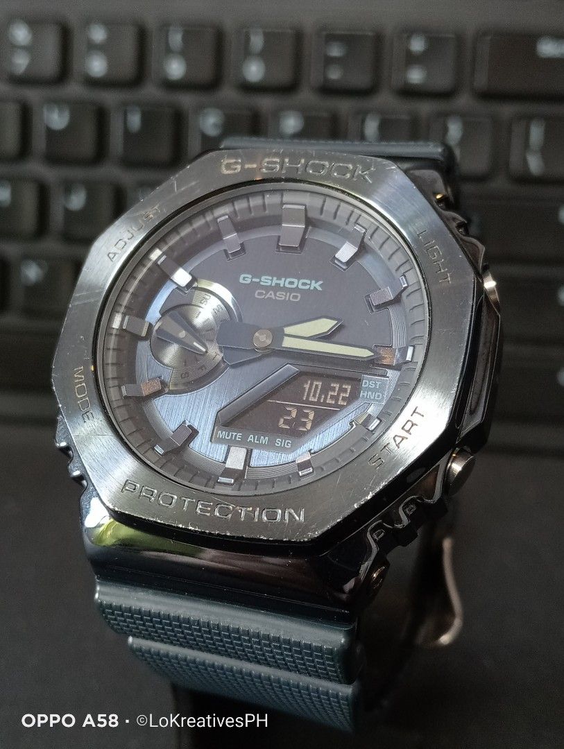 G-Shock GM-2100N-2A (Category: Men's Watches) located in Cavite. Submitted by purpose_served (Listing ID 1469730608, Image 2). Description: GM-2100N-2A G-STEEL GM-2100 Series An analog-digital timepiece from the metal-clad 2100 series featuring an octagonal stainless steel bezel with a dark blue ion-plated finish and a textured blue dial. Basic Information Price: MSRP ₱17,000 +++ Case size: 49.3 × 44.4 × 11.8 mm Weight: 72 g Case: Stainless steel