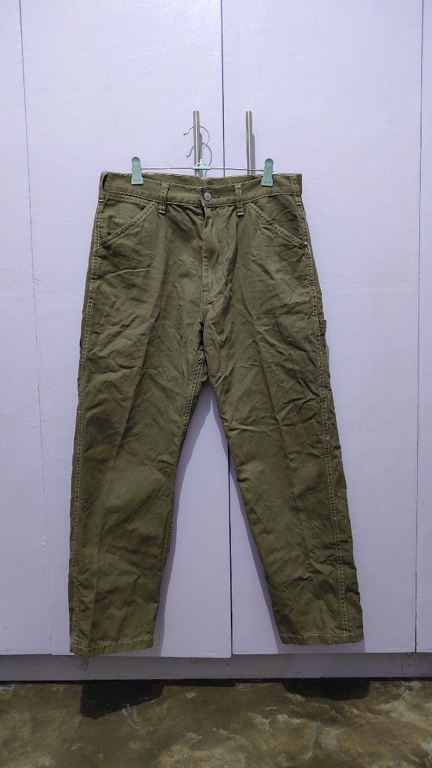 GU olive green utility cargo pants (Category: Trousers) located in Bacolor. Submitted by annjjjjj (Listing ID 1469643310, Image 1). Description: - Color: Olive green - Style: Relaxed fit with straight leg cut - Details: Multiple utility pockets and stylish contrast stitching - Waist: Mid-rise with belt loops - Material: Sturdy, durable fabric ideal for everyday casual wear.