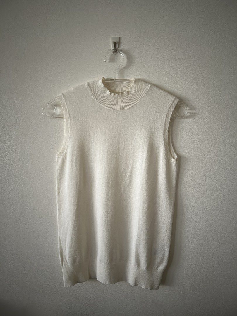 GU White Knit Mock Neck Tank Top (Category: Sleeveless) located in Makati City. Submitted by kt1030 (Listing ID 1469575824, Image 1). Description: - Brand: GU - Color: Crisp White - Style: Sleeveless knit top with mock neck - Material: Soft and lightweight rayon-nylon blend - Details: Ribbed texture at neckline and hem - Versatility: Great basic piece for layering or standalone wear.