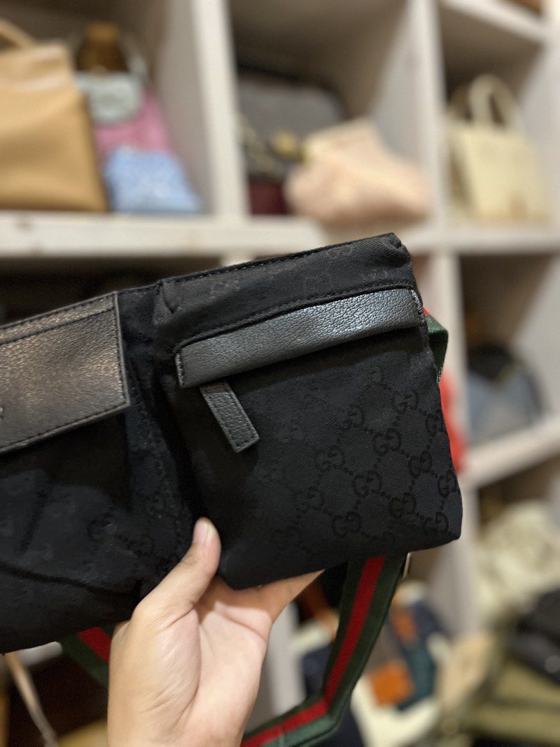 Gucci Black GG Canvas Web Strap Belt Bag (Category: Luxury Bags & Wallets) located in Bacolod City. Submitted by vintage_vogue6100 (Listing ID 1469670875, Image 3). Description: - Brand: Gucci - Material: Black canvas with iconic GG monogram and black leather trim - Design: Front flap pockets and secure back zip compartment - Strap: Signature green and red web stripe adjustable strap with silver-tone hardware - Interiore: Black fabric lining - Di
