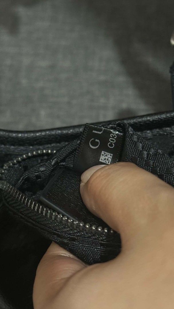 Gucci Black GG Monogram Canvas Shoulder Bag (Category: Luxury Bags & Wallets) located in Cavite. Submitted by loriojenni09117 (Listing ID 1469699710, Image 3). Description: - 21212Gucci black shoulder bag - Classic GG monogram canvas with dark hardware - Secure piston lock front closure - Clean interior with zip pocket, leather tag, and serial numbers - Includes an extra strap - Well-kept, clean inside and out.
