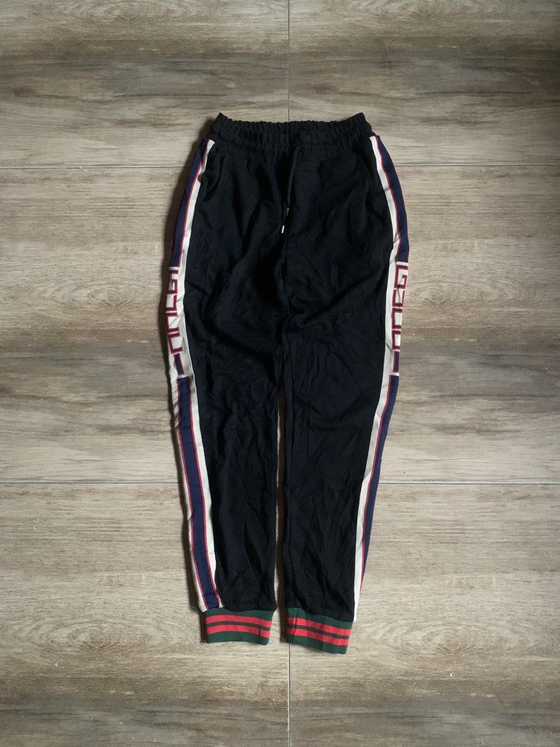 Gucci Black Jogging Pants Size M (Category: Joggers) located in Tarlac. Submitted by luxurious_apparel (Listing ID 1469658425, Image 1). Description: - Brand: Gucci - Item: Luxury Streetwear Sweatpants - Color: Black with signature side stripe branding - Size: Medium (Tag attached) - Material: Soft and comfortable cotton blend - Origin: Made in Italy - Features: Adjustable drawstring waistband and ribbed ankle cuffs.