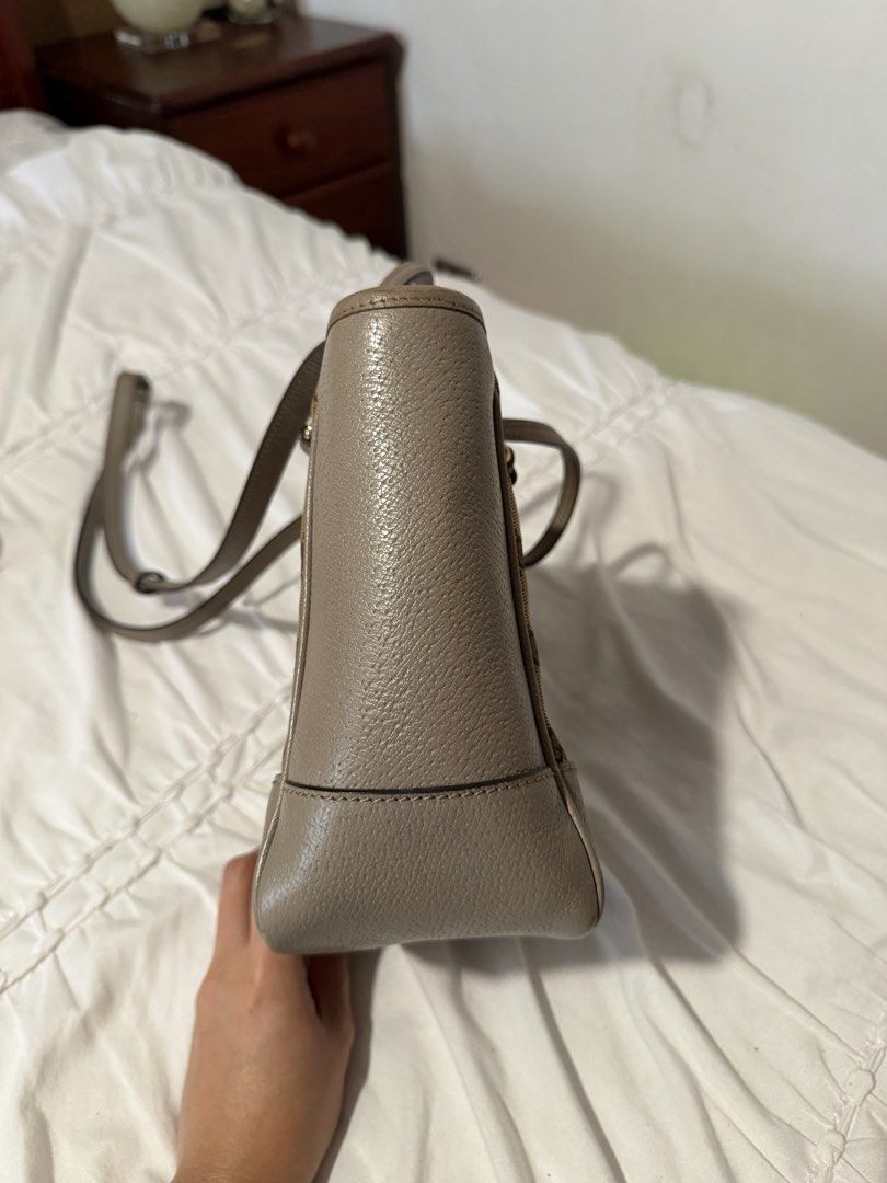 Gucci GG Canvas Bree Crossbody (Category: Luxury Bags & Wallets) located in Cavite. Submitted by gentlyused_ (Listing ID 1469675269, Image 3). Description: - Brand: Gucci Tote Bag - Material: Classic beige GG canvas with grey leather trim - Straps: Top handles and adjustable shoulder strap - Condition: Great everyday size, clean interior, structured shape, with minor scuffing on one bottom corner as pictured.