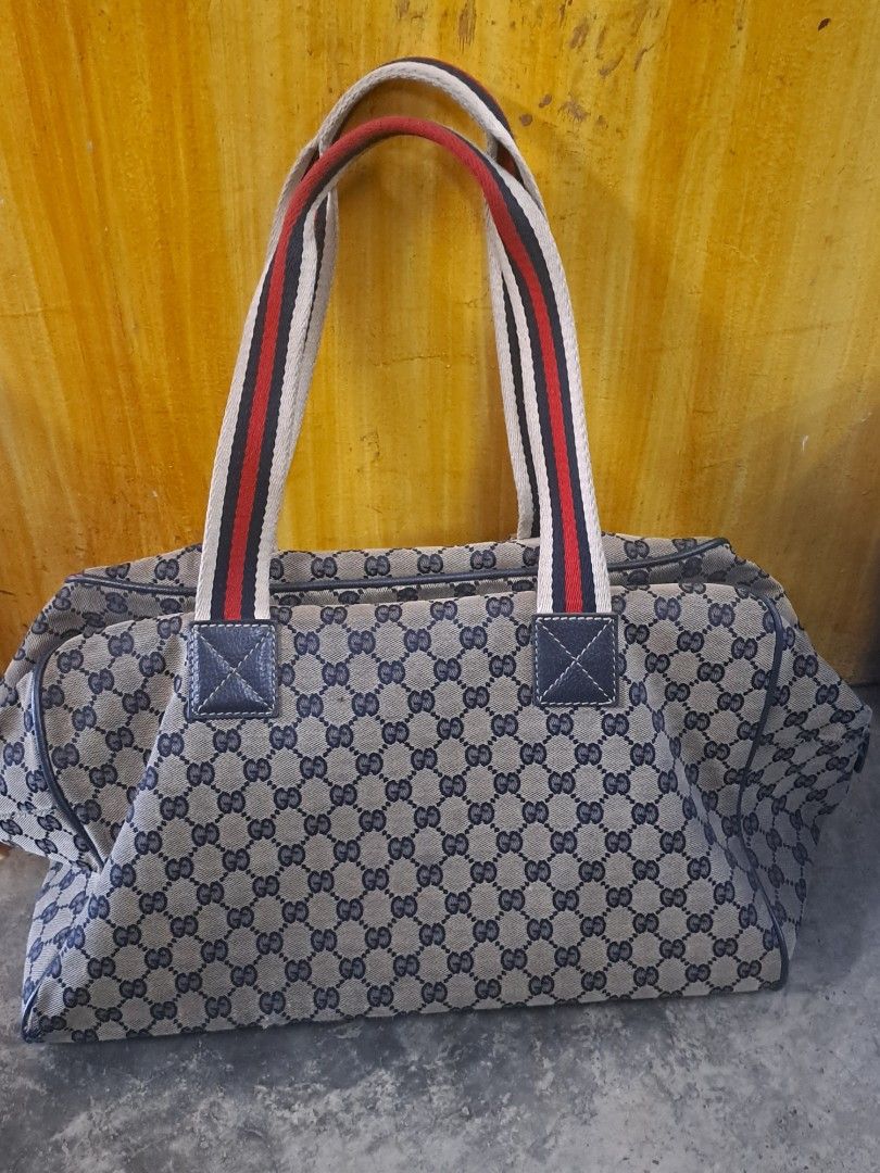 Gucci GG Canvas Web Travel / Duffle Bag (Category: Luxury Bags & Wallets) located in Puerto Princesa. Submitted by jercksthriftph (Listing ID 1469588984, Image 2). Description: Gucci GG Monogram Canvas Web Travel / Duffle Bag , Excellent Condition need cleaning item is thrifted/ukay.