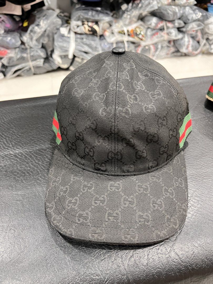Gucci GG Monogram Baseball Cap with Web Stripe (Category: Caps & Hats) located in Manila. Submitted by style_hoods (Listing ID 1469625343, Image 1). Description: - Brand: Gucci - Pattern: Classic GG monogram canvas - Detailing: Signature green and red web stripe on the sides - Sizes Available: M (58 cm) and L (59 cm), fully adjustable - Condition: Brand new with complete interior lining and care tags attached - Style: Timeless streetwear piece.