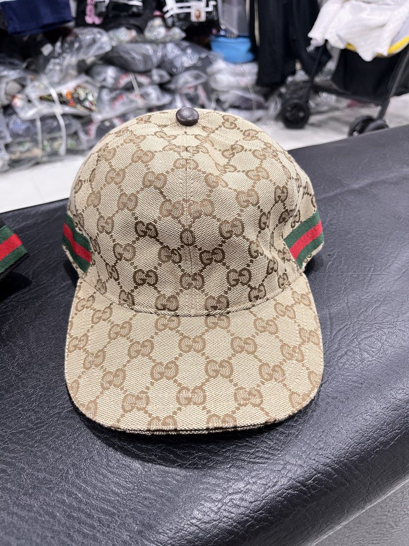 Gucci GG Monogram Baseball Cap with Web Stripe (Category: Caps & Hats) located in Manila. Submitted by style_hoods (Listing ID 1469625343, Image 3). Description: - Brand: Gucci - Pattern: Classic GG monogram canvas - Detailing: Signature green and red web stripe on the sides - Sizes Available: M (58 cm) and L (59 cm), fully adjustable - Condition: Brand new with complete interior lining and care tags attached - Style: Timeless streetwear piece.