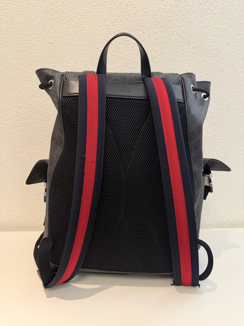 Gucci GG Supreme Black Backpack (Category: Backpacks) located in Pasig City. Submitted by closetofashopaholic (Listing ID 1469679229, Image 3). Description: - Authentic Black Gucci GG Supreme canvas backpack - Flap closure with stylish silver-tone metal buckles - Two convenient side pockets with flap closures - Secure drawstring opening underneath the top flap - Breathable red and black mesh shoulder straps - Sturdy top leather handle for easy ca