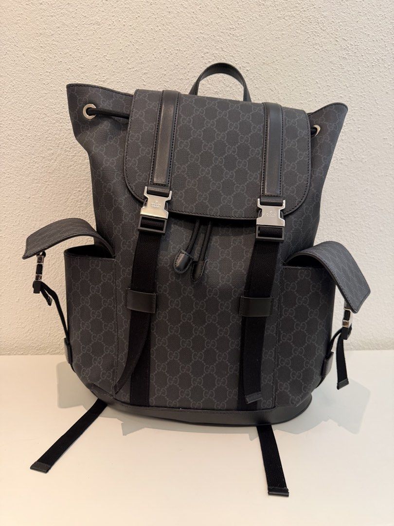 Gucci GG Supreme Black Backpack (Category: Backpacks) located in Pasig City. Submitted by closetofashopaholic (Listing ID 1469679229, Image 1). Description: - Authentic Black Gucci GG Supreme canvas backpack - Flap closure with stylish silver-tone metal buckles - Two convenient side pockets with flap closures - Secure drawstring opening underneath the top flap - Breathable red and black mesh shoulder straps - Sturdy top leather handle for easy ca