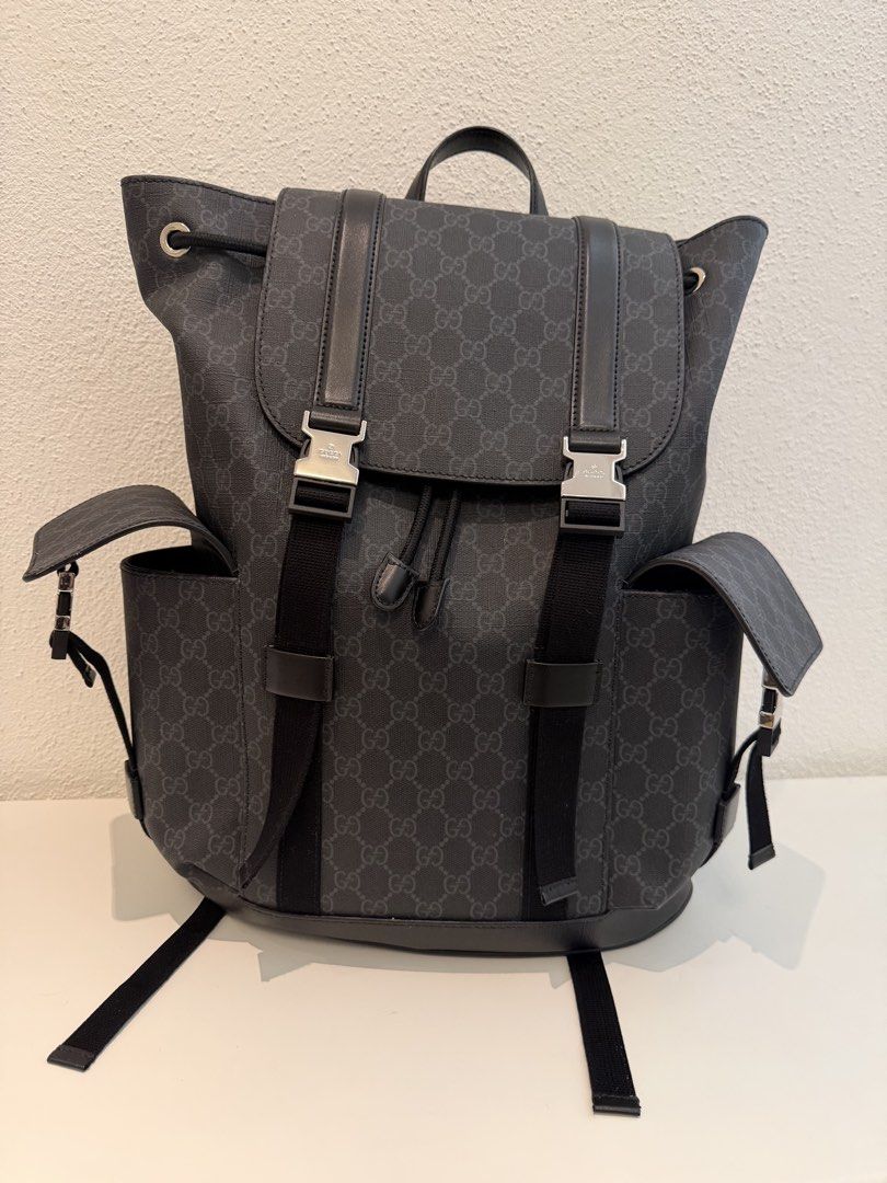 Gucci GG Supreme Black Backpack (Category: Backpacks) located in Pasig City. Submitted by closetofashopaholic (Listing ID 1469679229, Image 2). Description: - Authentic Black Gucci GG Supreme canvas backpack - Flap closure with stylish silver-tone metal buckles - Two convenient side pockets with flap closures - Secure drawstring opening underneath the top flap - Breathable red and black mesh shoulder straps - Sturdy top leather handle for easy ca