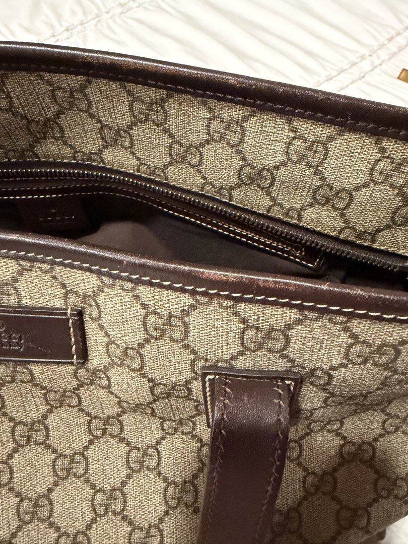 Gucci GG Supreme Joy (Category: Luxury Bags & Wallets) located in Cavite. Submitted by gentlyused_ (Listing ID 1469674894, Image 3). Description: - Authentic Gucci tote in iconic GG monogram canvas - Classic brown leather trim and comfortable double shoulder straps - Secure zip-top closure with a spacious interior and zipped pocket - Perfect everyday shoulder bag with plenty of room for essentials - Condition note: Noticeable wear along the top e