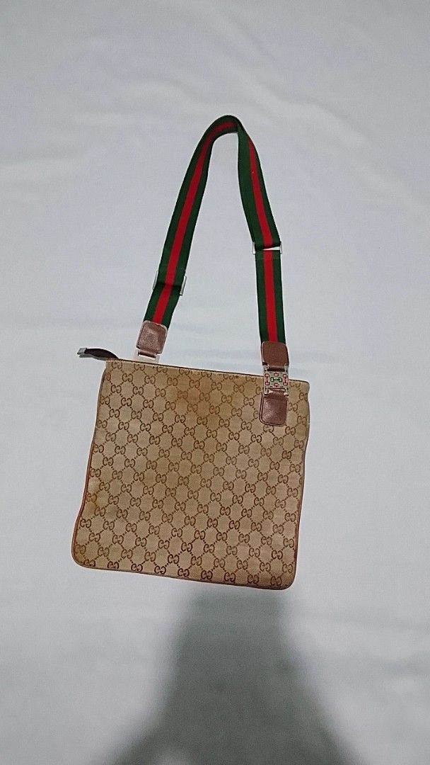 Gucci Monogram Canvas Crossbody Bag with Web Strap (Category: Luxury Bags & Wallets) located in Cagayan de Oro. Submitted by friderickv99131 (Listing ID 1469718723, Image 2). Description: - 100% Authentic Gucci Messenger Bag - Classic beige GG monogram canvas with durable brown leather trim - Signature green and red web strap with adjustable buckle - Secure top zip closure and convenient front zip pocket - Flat, rectangular everyday design that f