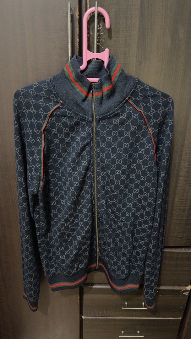 Gucci Monogram Zip-Up Track Jacket Size L (Category: Coats, Jackets and Outerwear) located in Manila. Submitted by itsmepey (Listing ID 1469730166, Image 1). Description: - Dark Navy with all-over GG monogram pattern - great condition with only broken zipper slider broken rfs: not using .