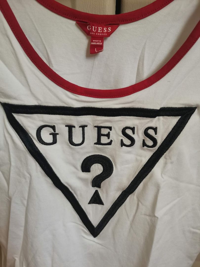 GUESS White and Red Ringer Bodysuit Size L (Category: Blouses) located in Manila. Submitted by mahanaim.67c328 (Listing ID 1469692503, Image 3). Description: - Brand: Guess - Item: White short-sleeve bodysuit with red ringer trim - Details: Large embroidered Guess triangle logo on front, snap-button bottom gusset - Size: Large - Condition: Brand new with original retail swing tags attached.