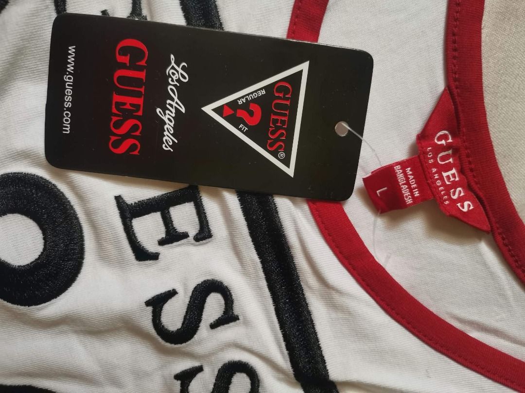 GUESS White and Red Ringer Bodysuit Size L (Category: Blouses) located in Manila. Submitted by mahanaim.67c328 (Listing ID 1469692503, Image 2). Description: - Brand: Guess - Item: White short-sleeve bodysuit with red ringer trim - Details: Large embroidered Guess triangle logo on front, snap-button bottom gusset - Size: Large - Condition: Brand new with original retail swing tags attached.
