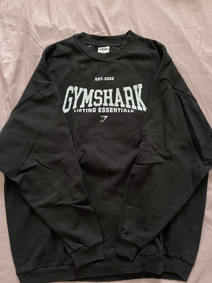 Gymshark Black Lifting Essentials Sweatshirt Size M (Category: Activewear) located in Caloocan City. Submitted by ripleyabre70238 (Listing ID 1469590203, Image 1). Description: - Brand: Gymshark - Color: Black - Size: Medium (M) - Features: Ribbed collar, cuffs, and hem - Material: Thick fleece-like inner lining, soft and cozy fabric - Condition/Use: Great for workouts or casual everyday wear.